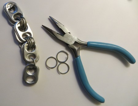 Attaching jump rings to the pop tabs.