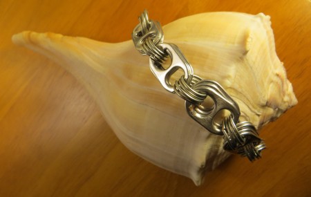 The completed bracelet on a shell.