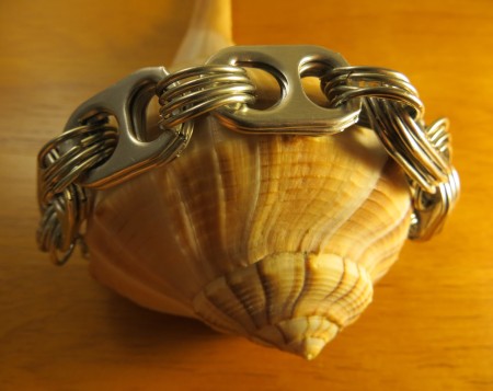 The completed bracelet on a shell.