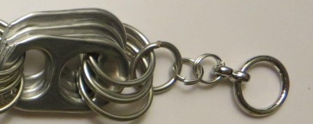 Adding a clasp to the jump ring.