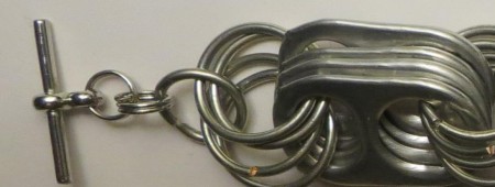 Adding a clasp to the jump ring.