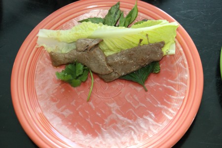 Adding beef to the spring roll.