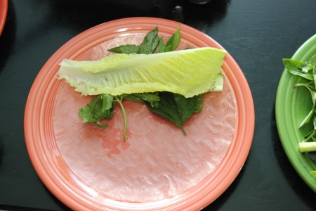 Assembling the filling for a spring roll.