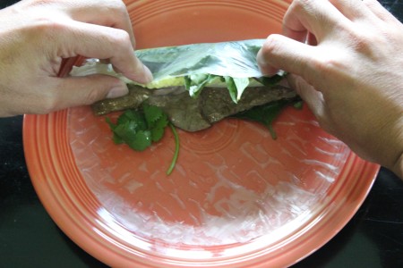 Rolling a spring roll.