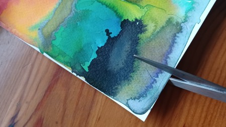 Cutting the painting into pieces.