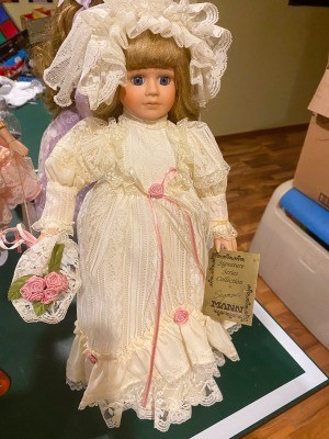 A doll in a white dress.