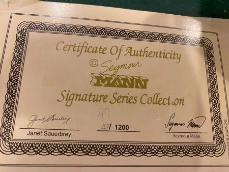 The certificate of authenticity for a porcelain doll.