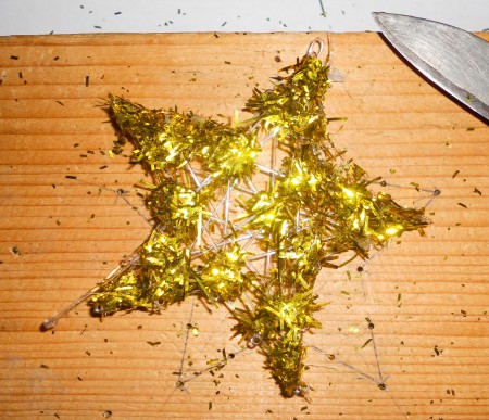 Removing the star from the frame.