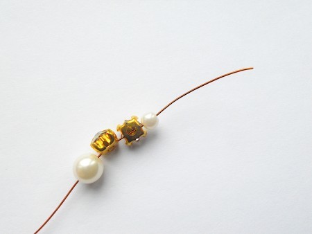 Adding beads to wire.