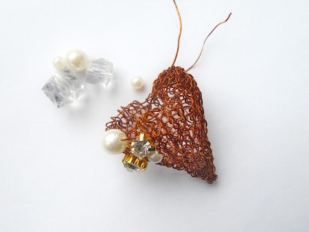 The finished knitted copper wire.