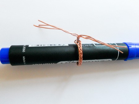 Wrapping the woven length into a ring shape.