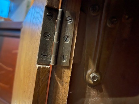 The hinge on a cabinet.