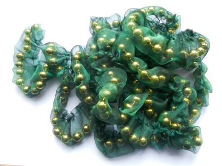 The organza tube with beads inside.