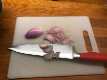 Cutting the shallots.