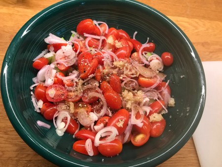 The vegetables marinating in the dressing.
