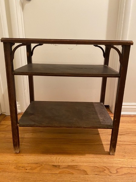 A small table with shelves.