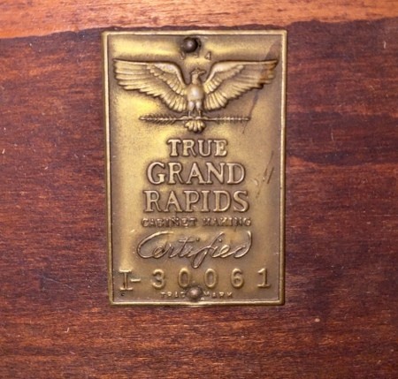 A manufacturer's marking on the underside of a table.