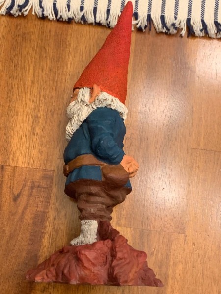 The side view of a gnome figurine.