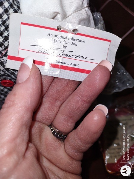 The certificate of authenticity on a porcelain doll.