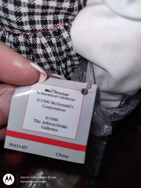 The certificate of authenticity on a porcelain doll.