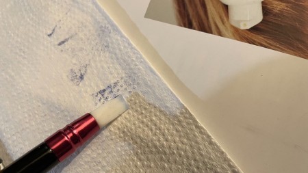 Cleaning off the soft paintbrush.