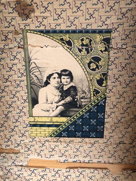 A graphic inside the lid of an old trunk.