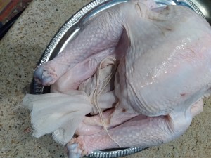 The turkey with a stuffing package inside.
