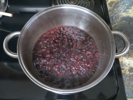 Cooking the cranberry sauce.