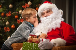 A boy talking to Santa.