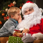 A boy talking to Santa.