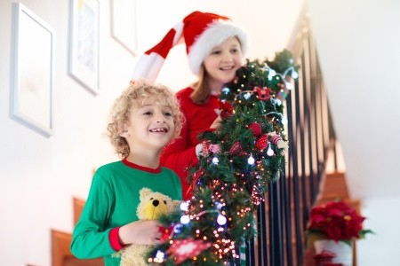 Children coming down the stairs on Christmas morning.