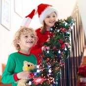 Children coming down the stairs on Christmas morning.