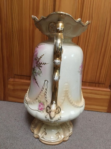 The side of a large ceramic vase.