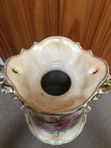 The top of a large ceramic vase.