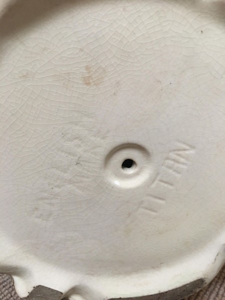 Markings on the bottom of the vase.