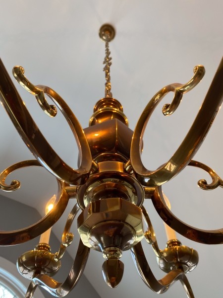 A close up of a brass chandelier.