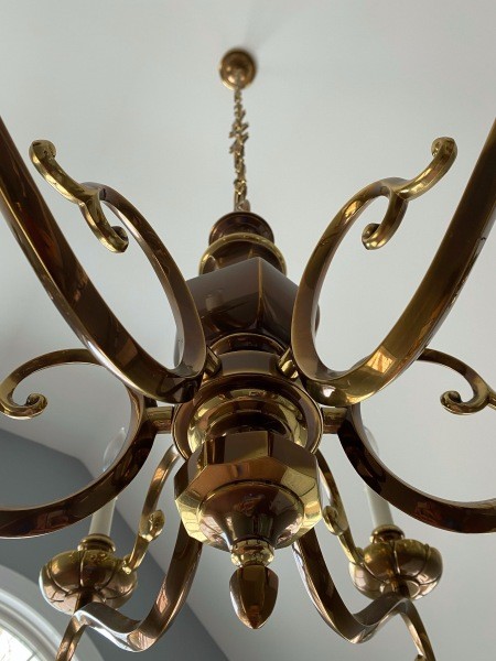 A close up of a brass chandelier.