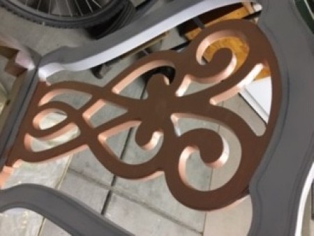 Painting the wooden chairs white.