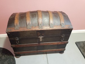 An old trunk with a domed lid.