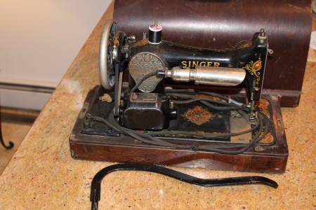 An old electric Singer sewing machine.