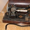 An old electric Singer sewing machine.