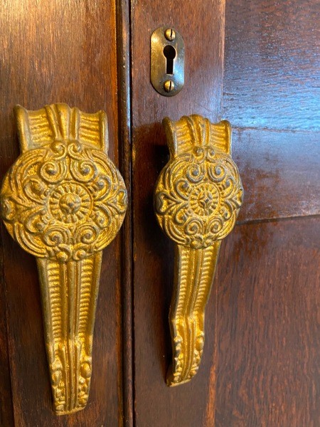 The close up of the wardrobe's door handles.