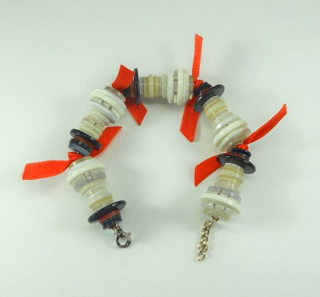 Adding ribbons to the bracelet.