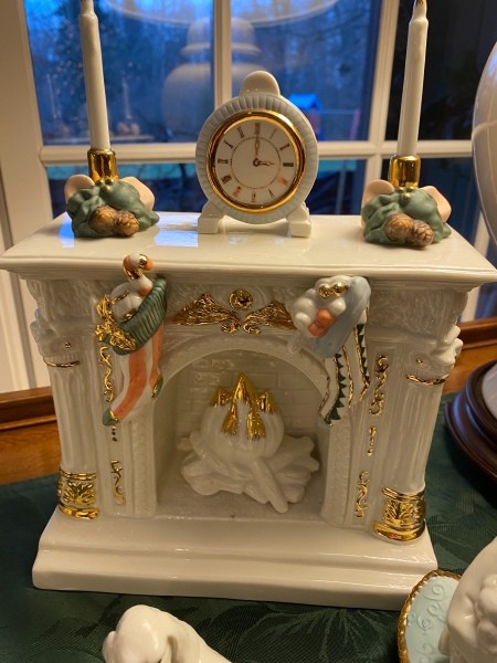 A figurine of a fireplace and mantle.