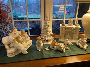 A collection of figurines featuring Santa and kids.
