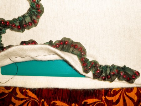 Detail of laying ribbons on the sweater