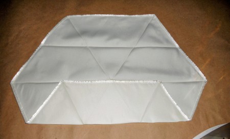 Demonstrating how to fold and iron fabric