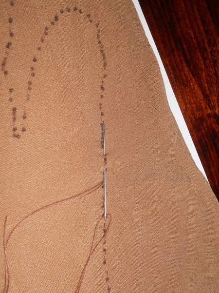 Sewing the dusting fabric to the glove.