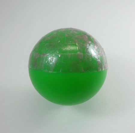 Half the ball is covered with eyeshadow and tape