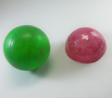 Pulling a hemisphere of tape off the ball